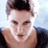 Static 48x48 pixel icon showing a person's face with short dark hair and light skin, wearing a dark top against a light blue background.