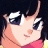 Pixelated anime-style character with dark hair and large eyes, wearing a red top, next to black background with white text.