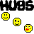 Pixel art composition with repeating 'HUGS' text, yellow smiley faces, alternating black-and-white square frames with cyan or red 'NOT', and blue 'DRUGS' banners.