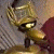 A split-frame contact sheet showing a pixelated golden robot head on the left and green text reading "Original Icons .com" on the right against a dark background.