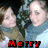 A pixelated image of a person in blue clothing with two text banners below, one red reading 'Merry' and one green reading 'Christmas'.