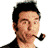 Pixelated static icon of a man with dark hair, mustache, and goatee holding a smoking pipe in his mouth against a white background.