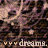 A static image with a repeating pattern of stylized faces and text reading 'dreams.' in light purple on dark brown background.