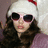 A static pixelated image shows a person wearing dark sunglasses, long brown hair, and a white hat with red accents against a light background.