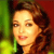 Pixelated close-up of a person with brown hair against a green and red background, static image with no visible text or motion.