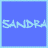 Two side-by-side blue display the name 'SANDRA' in light blue pixelated text with a small heart symbol appearing on the right