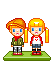 Two pixel-art figures stand on a green base; one holds red hearts while pink hearts float around them in various frames.