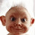 A pixelated character with large ears and a smiling expression appears in four showing slight variations