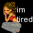 Pixelated character with brown hair and red shorts sits on a gray cloud-like shape, resting head on hand while text reads 'im tired' in white block letters.