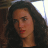 Static 48x48 pixel icon showing a close-up of a woman's face with dark hair and red lips against a blurred background.
