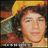 Pixelated image of a person with curly dark hair wearing a yellow cap, with pink text reading 'Nick Jonas' on a black background.