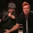 Two people in dark clothing appear in a split-screen layout with cyan pixelated text reading 'billie joe- AAAHHHH' and 'A SPIDER!' on black backgrounds.