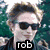A static image of three people with overlaid text labels, arranged in a with a gray background on the right