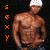 Two side-by-side animated frames of a muscular shirtless man wearing white headwear and dark shorts, with vertical text on the left side changing color between orange and yellow.