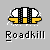 Pixel art icon of a yellow and black vehicle with white headlights on gray background, below which is pixelated text reading "Roadkill".