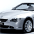 Pixelated silver car with visible front wheel, side window, and partial hood, rendered in low-resolution grayscale tones.