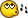 Pixelated yellow circular icon with brown outline and white border, featuring two large cartoon eyes with dark pupils and white highlights, plus a small brown dot on the right side, set against gray background.
