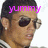 Pixelated close-up of a person's face with dark hair, wearing dark sunglasses, and having pink text 'YUMMY' overlaid on the forehead.