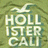 Pixelated text logo with stylized 'H' and wave above, set against a greenish-brown background.