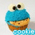 Pixelated blue and brown cupcake-shaped icon with large white eyes and black pupils, displaying the word 'cookie' in light blue text below.