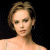 Pixelated image of a person with light brown hair against black background, next to green text reading OriginalIcons.com.