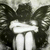 Pixelated grayscale image of a figure with large dark wings and a white torso, standing against a light background.