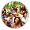 Group of people outdoors in two circular frames with a landscape scene below.