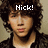 Pixelated image of a person with curly hair wearing a dark jacket over a light shirt, with text above the head.