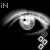 A grayscale animated eye with a rainbow arc above, displaying text fragments and changing circular elements.