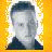 Yellow background with a pixelated portrait of a person and text reading 'chris the official site' in black block letters.