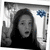 A grayscale animated icon shows a person with long dark hair making a peace sign, with a blue floral symbol in the background.