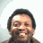 Pixelated image of a smiling person with short dark hair against light background, alongside blue text reading 'sneaky pete' and 'Original Icons .com' on black backgrounds.