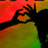 A green background displays four text elements and a partial figure with red, orange, yellow, and black colors.
