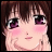 Anime-style character face with brown hair, purple eyes, and pink cheeks, next to pixelated text on black background.