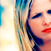 Close-up of a person with blonde hair and red lips, cropped to show only the right side of the face.