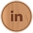 Circular wooden-textured icon with brown lowercase 'in' letters centered on a light brown background.