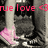 Pixelated image with pink text 'true love <3' over a grayscale figure holding a pink heart-shaped object.