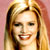 Static pixelated image of a smiling person with long blonde hair against a pinkish background, rendered in low resolution typical of early 2000s buddy icons.