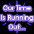 Pixelated clock face with blue hands and markers on black background, displaying text Our Time Is Running Out... in purple rectangular blocks.