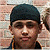 A 50x50 pixel animated buddy icon featuring a person in front of a brick wall on the left and green text reading "Original Icons .com" on the right, displayed as a contact sheet with two frames.