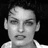 Static grayscale pixel art of a person's face with visible dithering and anti-aliasing, cropped to show head and shoulders against black background.