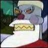 A gray cartoon character with a red nose, white beard, and glasses holds a yellow box with a wavy line pattern against a blurred green and red background.