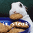 A white rabbit with brown ears holds a cookie in its mouth, positioned above a blue tray of cookies against a dark green background.