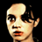 Pixelated static image of a person's face with visible facial features and partial hair, rendered in low resolution on black background.