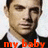 Pixelated portrait of a person with short dark hair wearing a dark jacket over a white shirt, with red text reading 'my baby' at the bottom.
