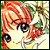 Pixelated close-up of a character with orange hair and large black eyes, set against a light background with green foliage elements.