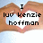 Pixelated image of two hands forming a heart shape with a white center, overlaid with black text reading "I luv kenzie hoffman" against a light blue background.
