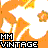 Pixelated orange and white icon with 'MM VINTAGE' text in black and gray blocks, featuring a stylized flame-like shape.