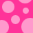 Pink polka dots on a bright pink background with one dot having a missing segment.