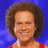Pixelated image of a person with curly brown hair wearing a red top against a blue background, with text reading "I luv Richard" on blue and gray